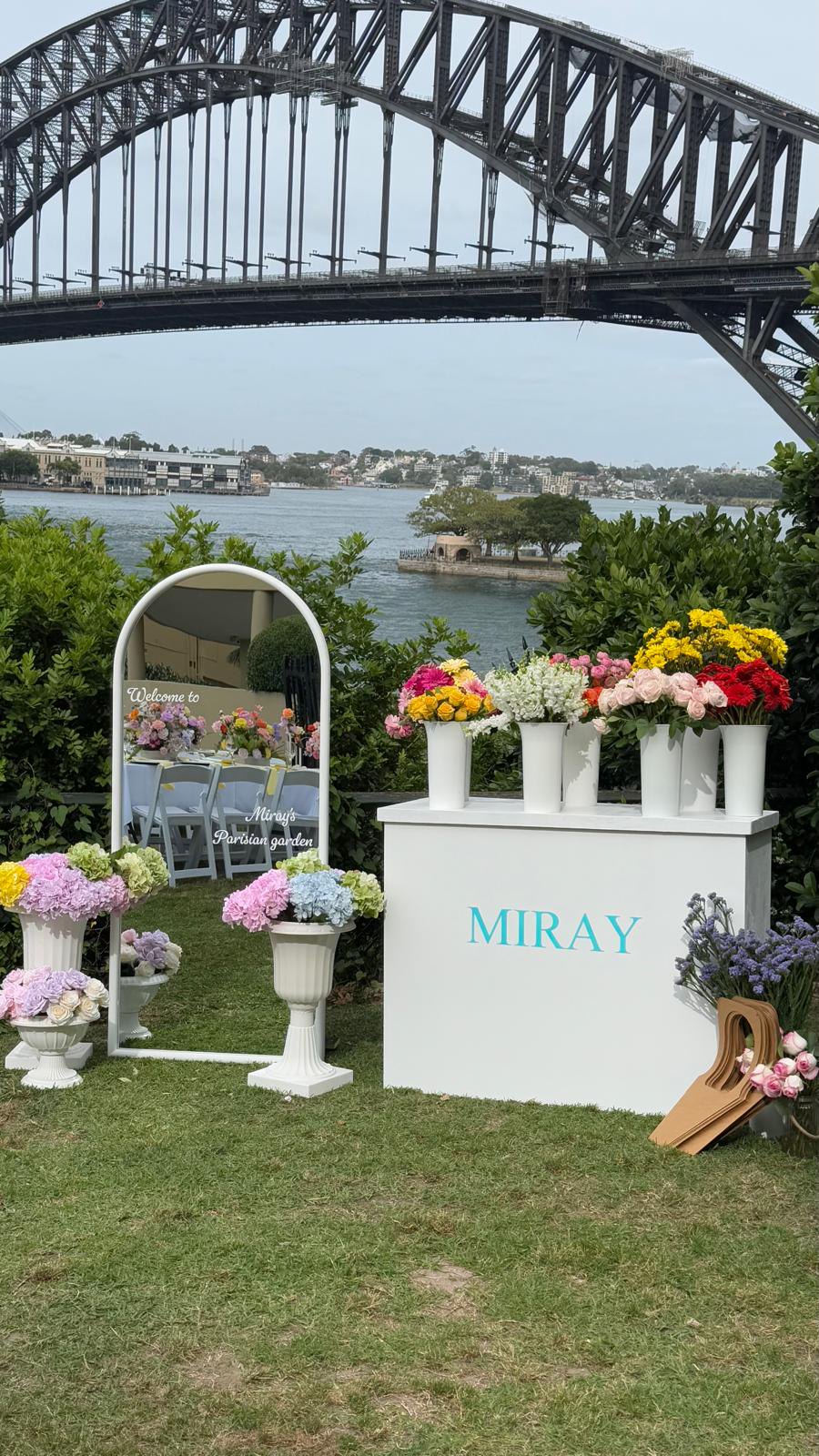 MIRAY flower bar, floral displays and an arched mirror overlooking Sydney Harbour Bridge